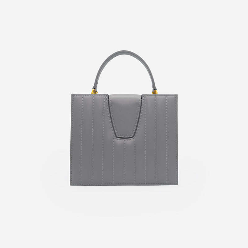 Sac M24/20 par MAES Paris - vue de dos [color:gris tempête,storm grey][finish:doré,gold]